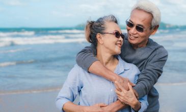 Couple enjoys each others company on beach